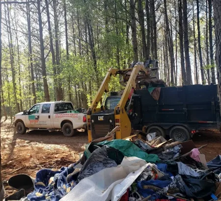 showing a large-scale, professional cleanup of a heavily trashed campsite.